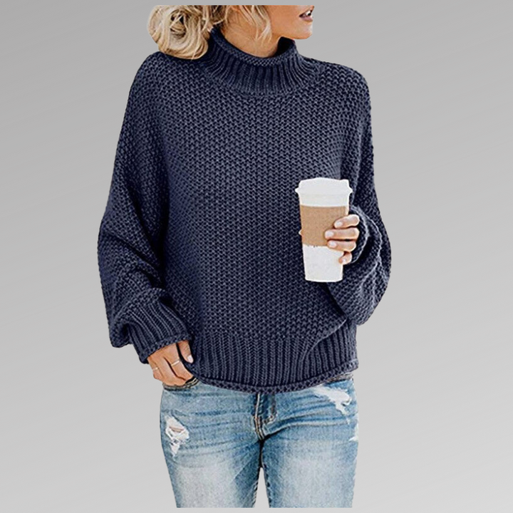 Suéter feminino que une conforto e estilo, em malha clássica para outono/inverno.