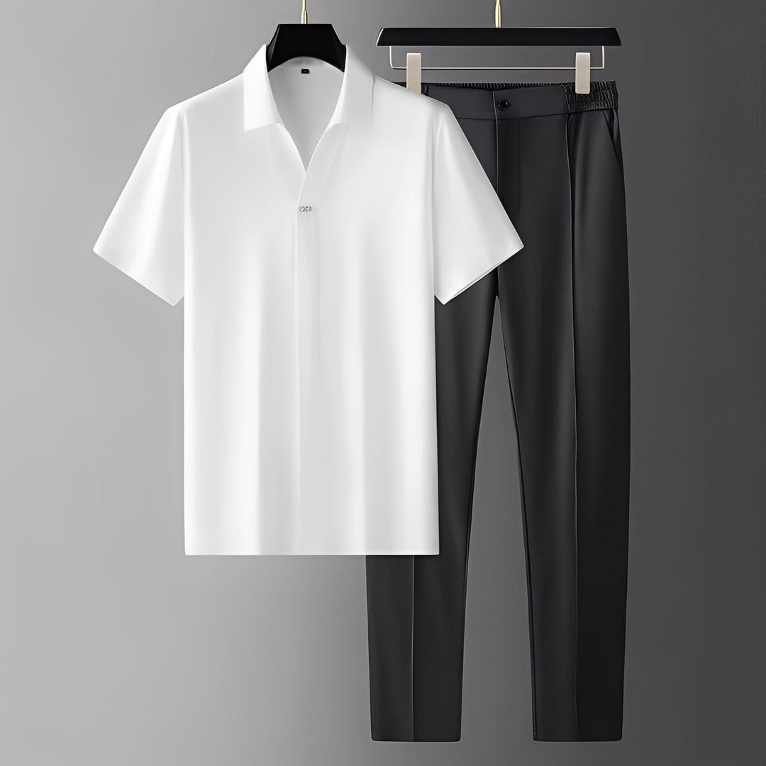 Conjunto masculino elegante de polo curto e calças. Ideal para primavera/verão, oferecendo estilo casual e conforto.