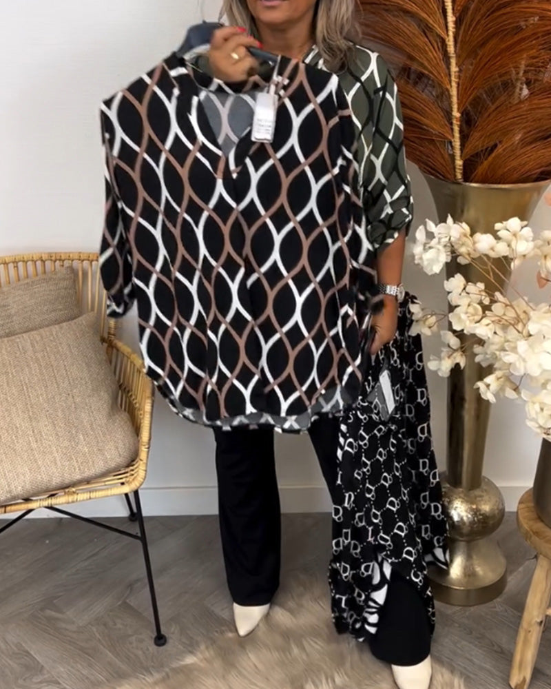 Blusa feminina estampada, casual chic, de manga longa. Essencial para moda feminina com versatilidade.