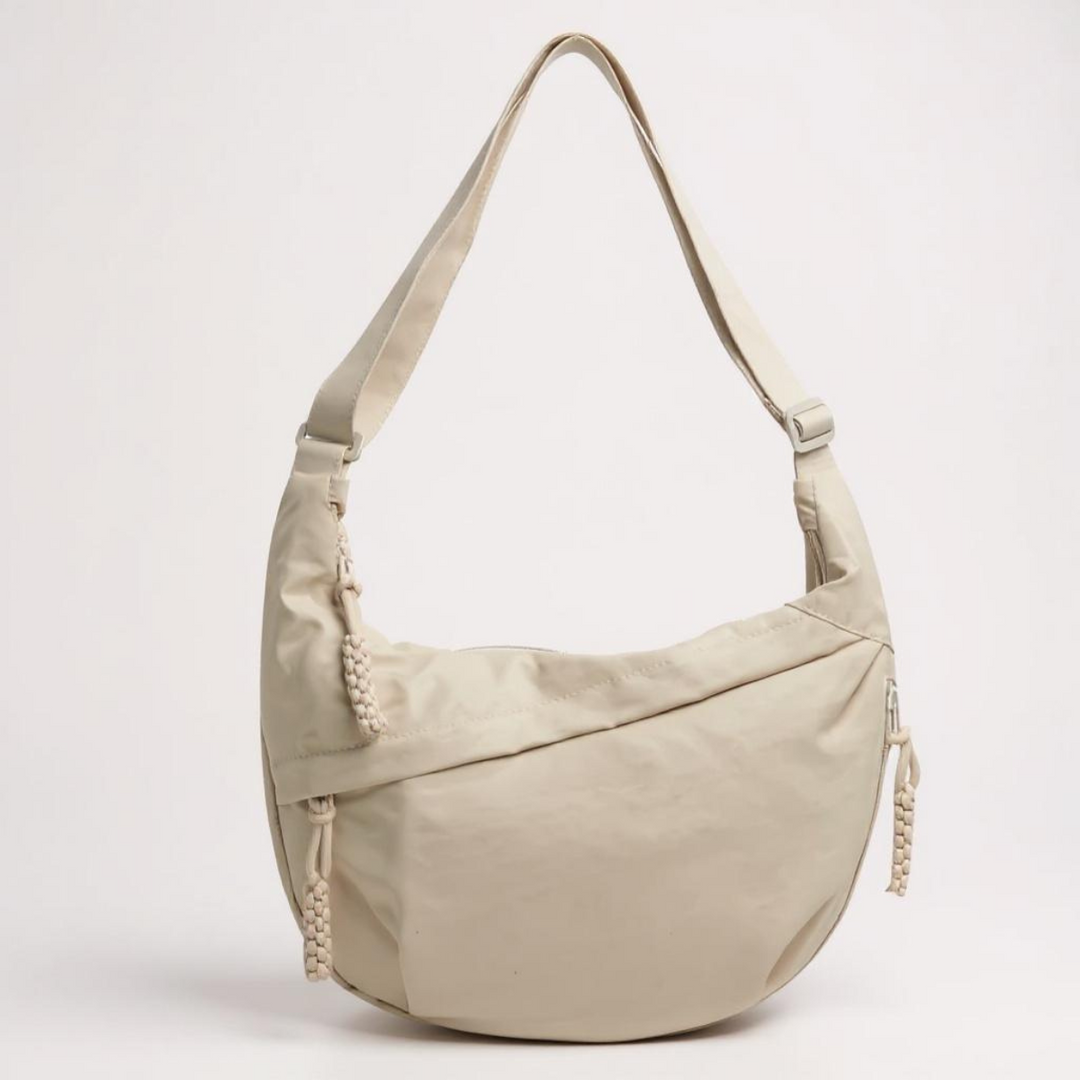 Acessório de viagem e casual: bolsa transversal feminina antifurto com zíperes e compartimentos para praticidade e segurança.