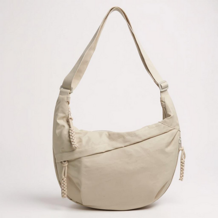 Acessório de viagem e casual: bolsa transversal feminina antifurto com zíperes e compartimentos para praticidade e segurança.