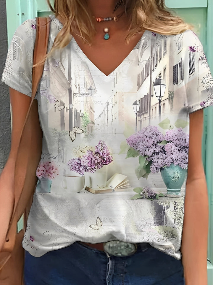 Top feminino elegante com estampa floral vibrante, ideal para verão e primavera, moda casual e confortável.