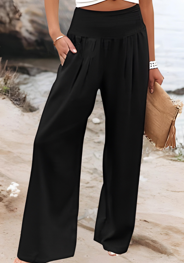 Calças femininas Lily de perna larga, conforto e estilo fluido para o verão. Roupa casual e tendência beachwear.