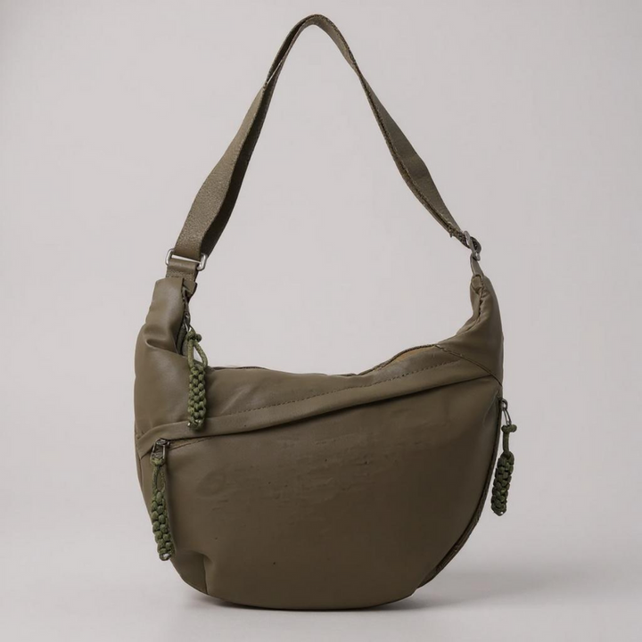 Bolsa feminina moderna transversal antifurto, com compartimentos e zíperes, para viagem ou casual, oferecendo segurança.