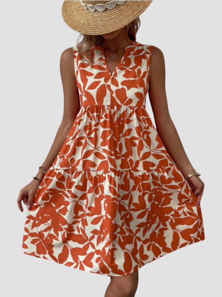 Vestido de verão feminino, estilo midi, com estampa tropical vibrante. Confortável e leve para dias quentes.