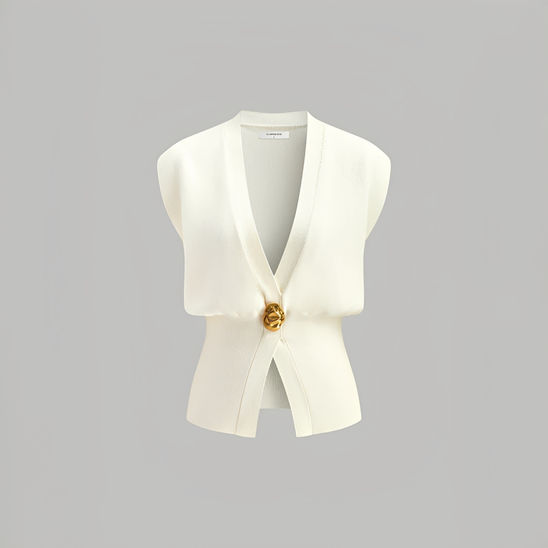 Colete feminino versátil com decote V, essencial para camadas elegantes em looks de outono e moda casual inteligente.