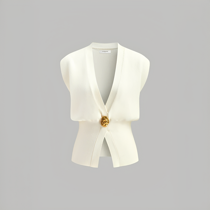 Colete feminino versátil com decote V, essencial para camadas elegantes em looks de outono e moda casual inteligente.