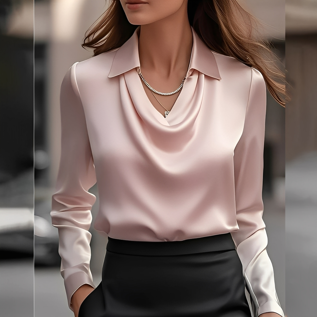 Estilosa blusa feminina com decote drapeado e manga longa. Um toque de elegância no seu guarda-roupa.