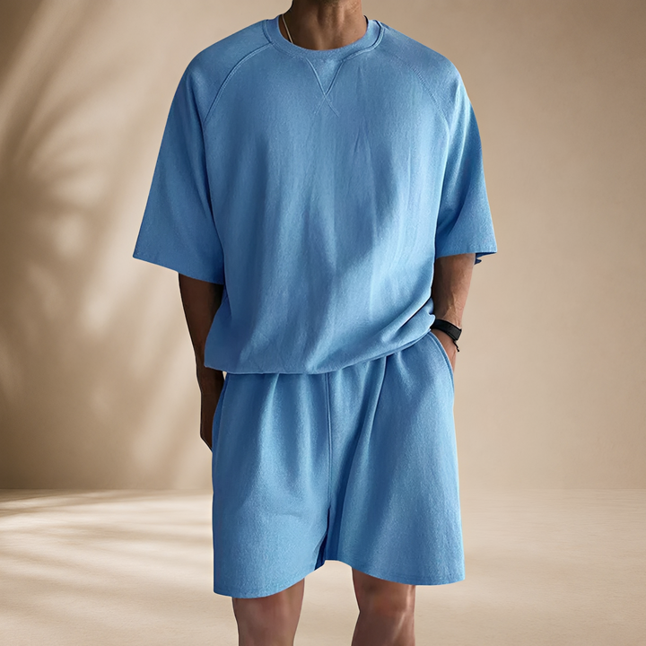 Conjunto masculino casual solto de 2 peças com camisa e shorts. Ideal para verão, estilo descontraído e dia a dia.