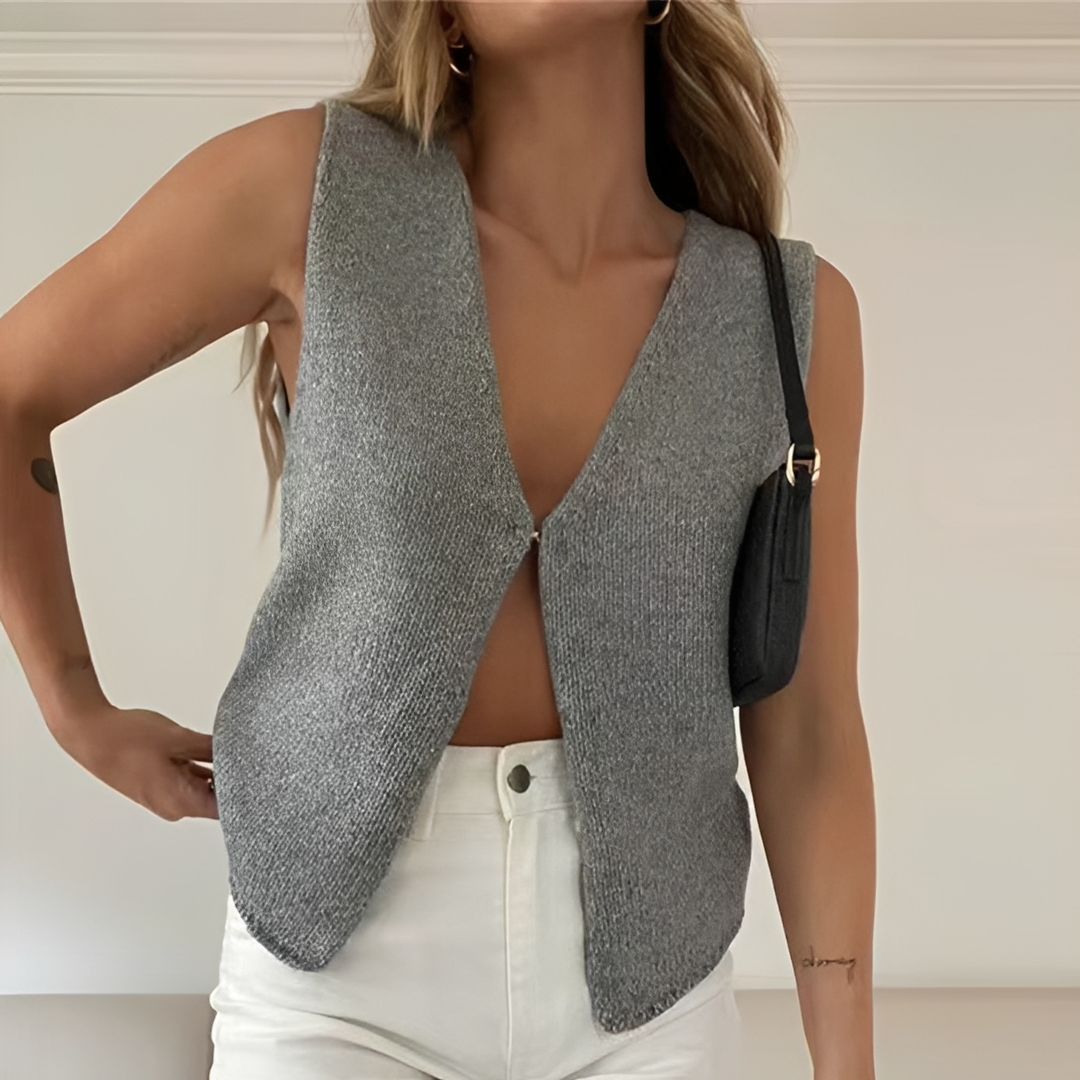 Colete feminino sofisticado sem mangas, perfeito para looks elegantes e versáteis, do casual ao escritório. Moda chique.