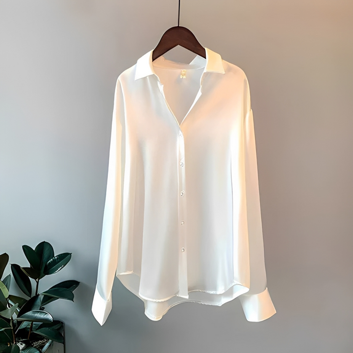 Camisa feminina elegante de manga longa brilhante, ideal para looks sociais ou casuais da moda primavera/verão.