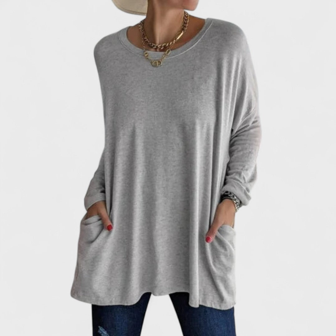 Blusa feminina versátil Moira de manga longa, ideal para moda casual e look relaxado.