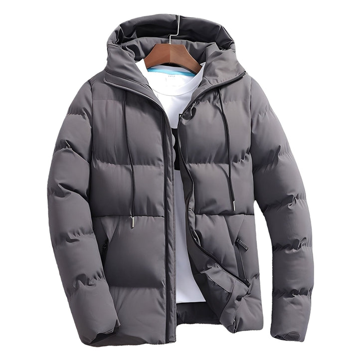 Jaqueta masculina acolchoada com capuz, ideal para inverno e outono. Estilo casual e moderno, oferece proteção contra vento.
