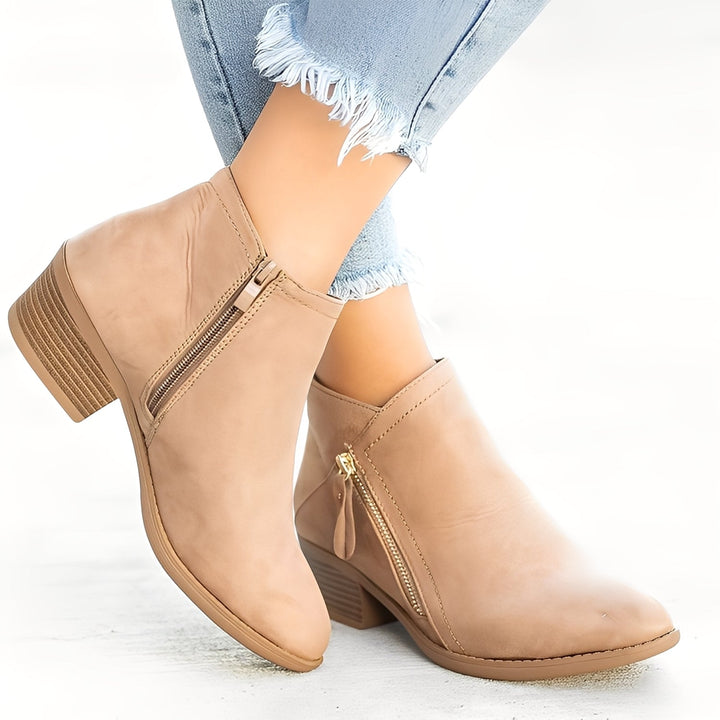 Botas femininas elegantes com fecho, ideais para conforto e estilo no outono/inverno.
