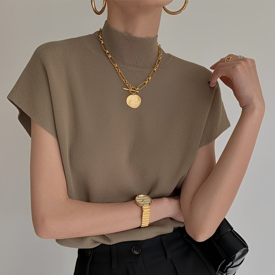Top feminino gola alta Rhea, elegante e versátil. Perfeito para moda outono e estilo casual chic.