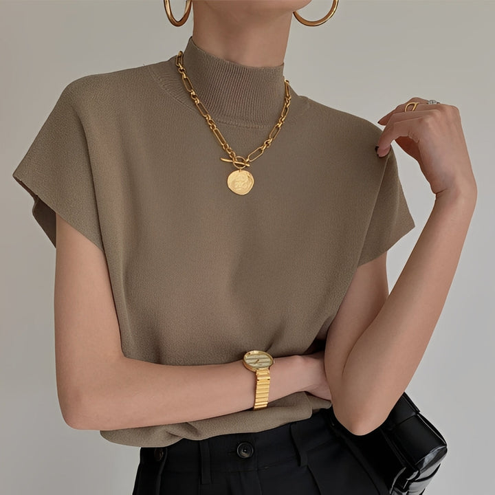 Top feminino gola alta Rhea, elegante e versátil. Perfeito para moda outono e estilo casual chic.