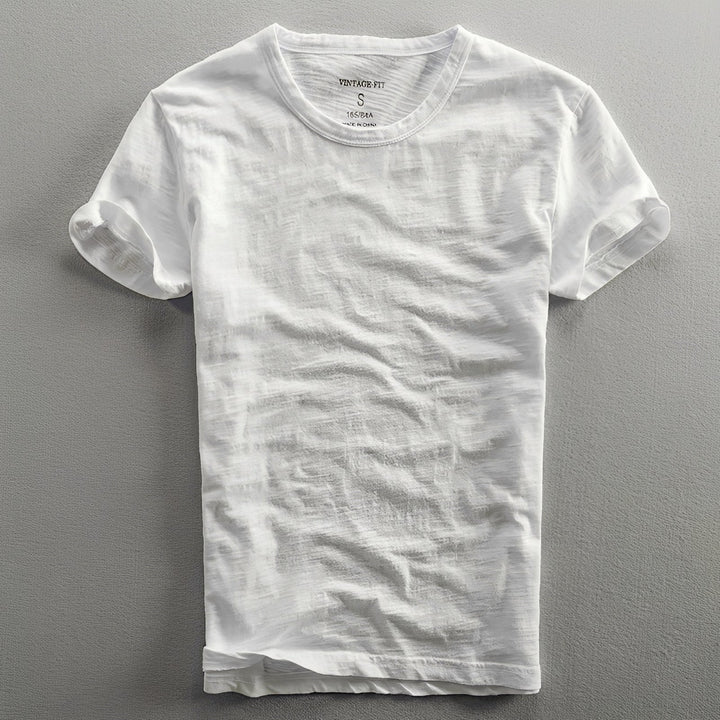 Camiseta masculina clássica vintage, tecido macio, cores desbotadas, casual e confortável.