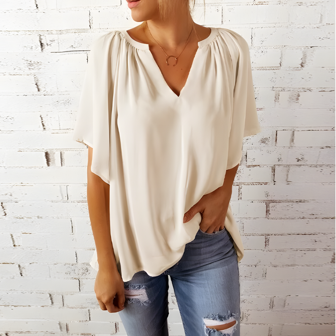 Camisa blusa feminina decote V, estilo fluido e elegante. Confortável para uso casual ou ocasiões especiais.