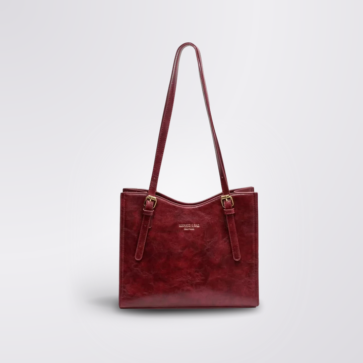 Fecho e fivela da Bolsa Feminina de Ombro Lena preta, detalhes que realçam o estilo vintage.