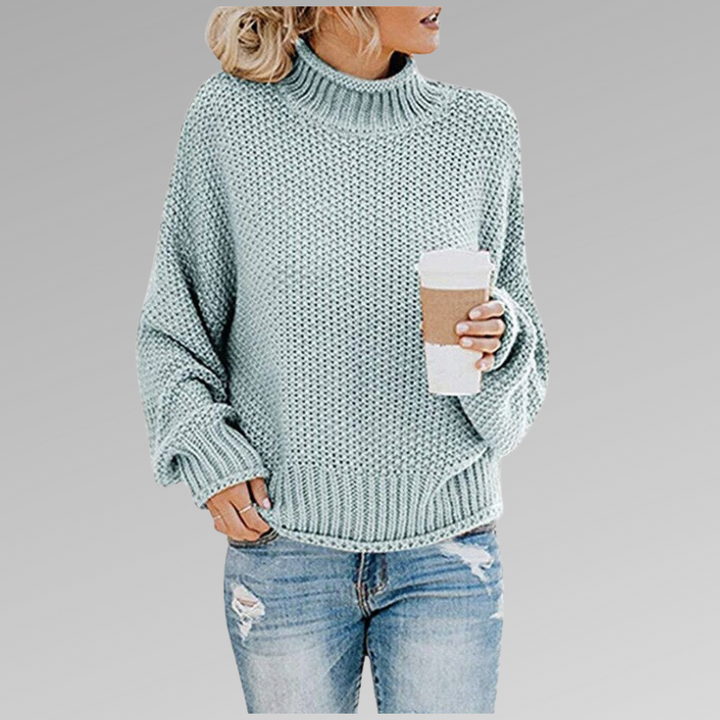Suéter feminino elegante de malha, design clássico versátil para moda casual e sofisticada.