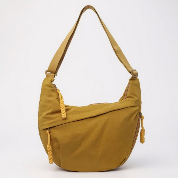 Prática bolsa transversal feminina com múltiplos compartimentos para organização eficiente, ideal para acessórios e viagem.