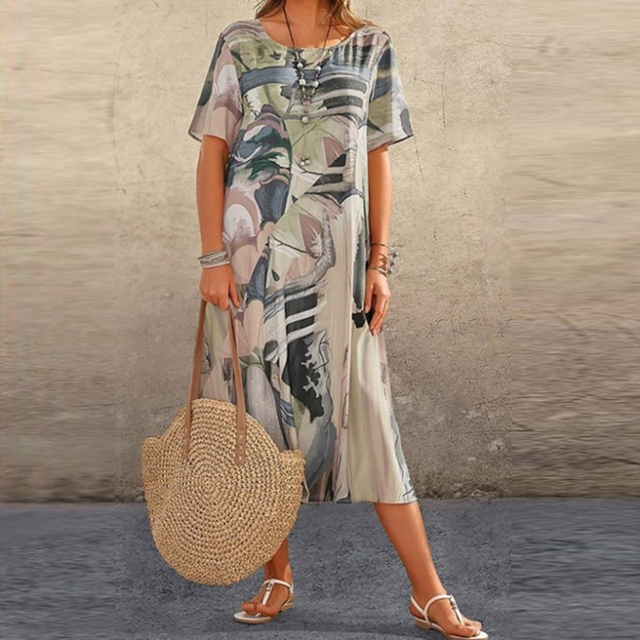 Vestido feminino elegante com estampa abstrata. Confortável e colorido, perfeito para o dia a dia na primavera/verão.