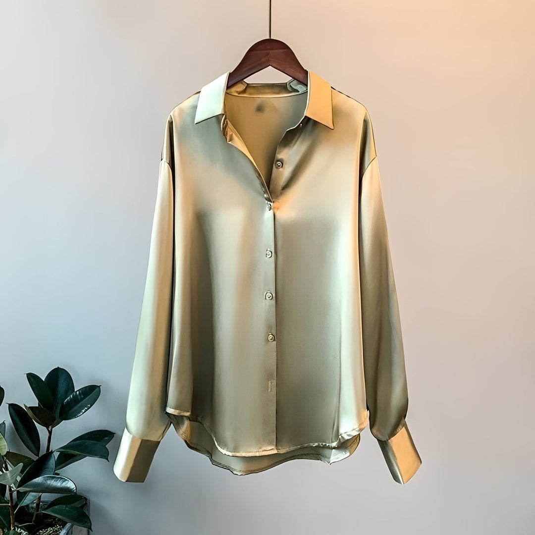 Blusa social feminina de manga longa, ideal para ambiente de trabalho e eventos, com design elegante e versátil.