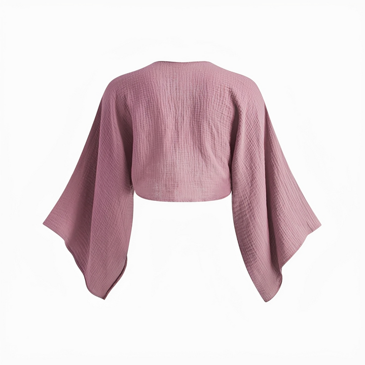 Look feminino com blusa roxa estilosa, apresentando um lindo laço frontal. Roupa versátil para a moda casual.