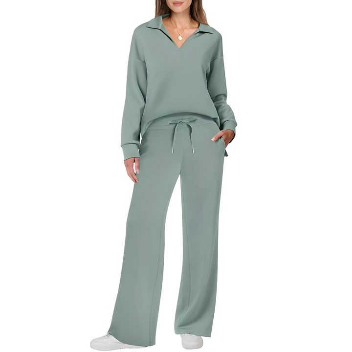 Modelo vestindo conjunto feminino elegante e confortável com suéter macio e calças casuais.