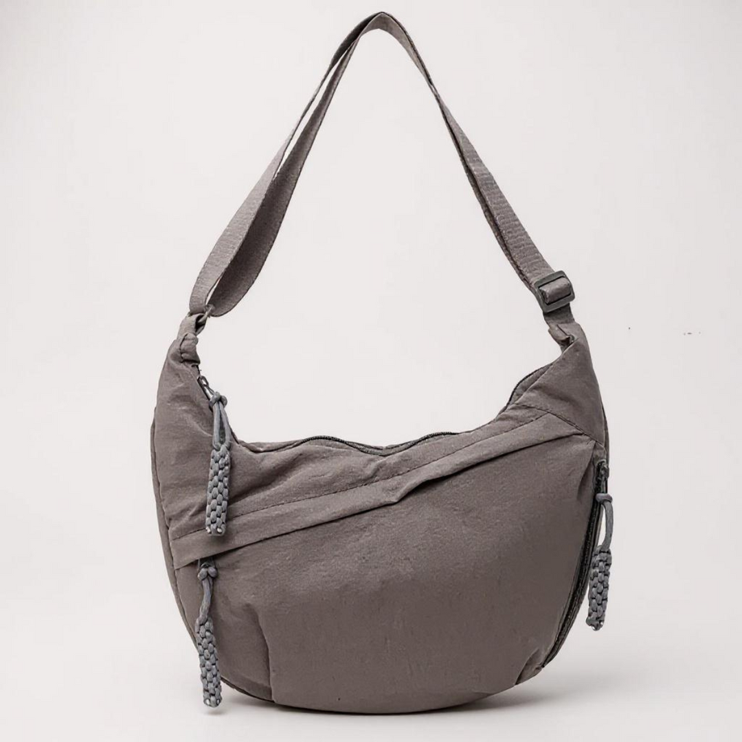 Confortável bolsa de ombro feminina transversal, com design funcional, múltiplos compartimentos e zíper para praticidade.