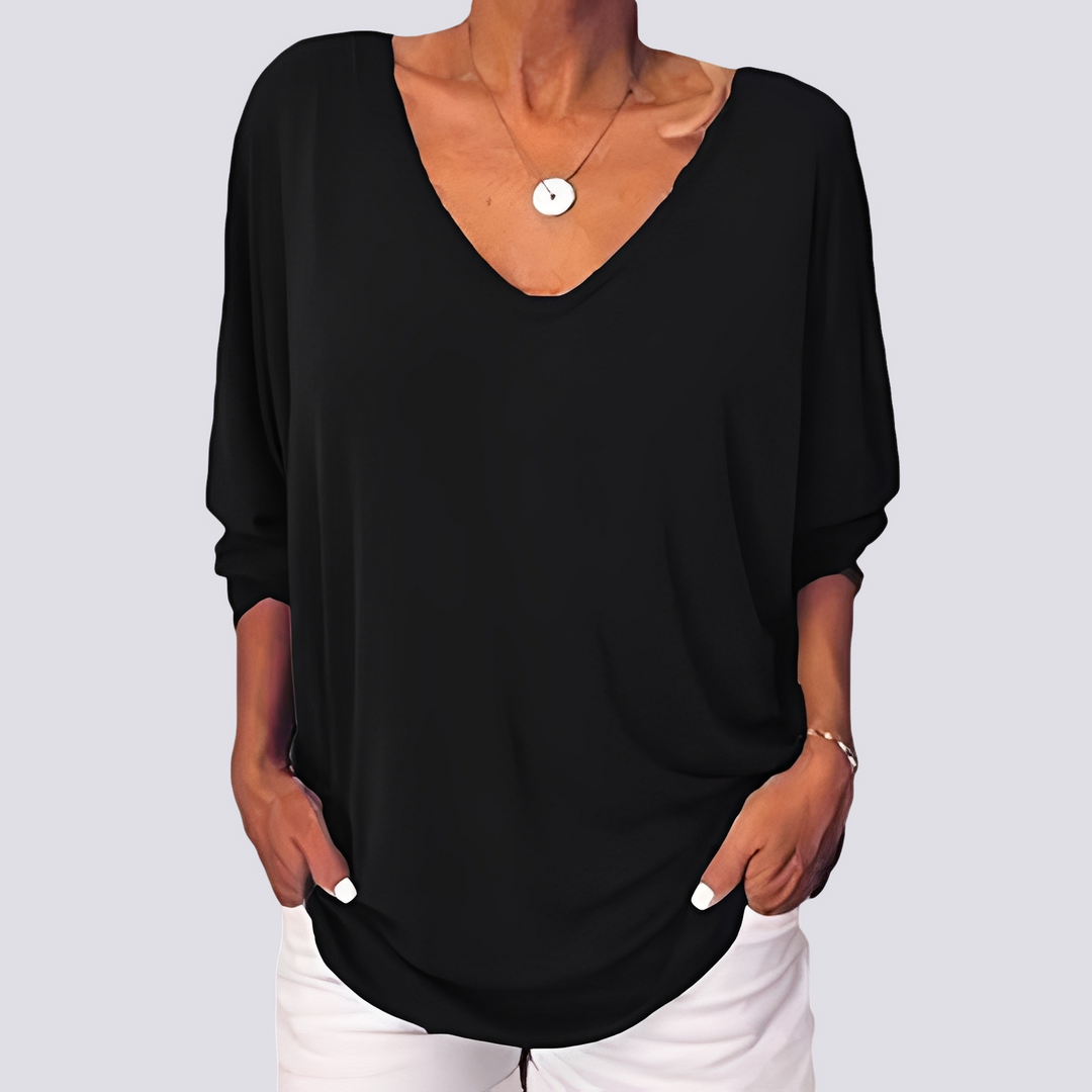 Camisa feminina confortável e estilosa, com botões nas costas. Disponível em plus size para o verão.
