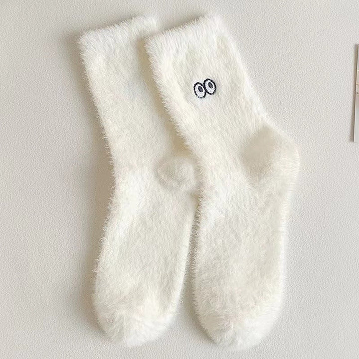 Close-up de meias femininas super fofas e aconchegantes. Perfeitas para manter os pés quentes e confortáveis no inverno.