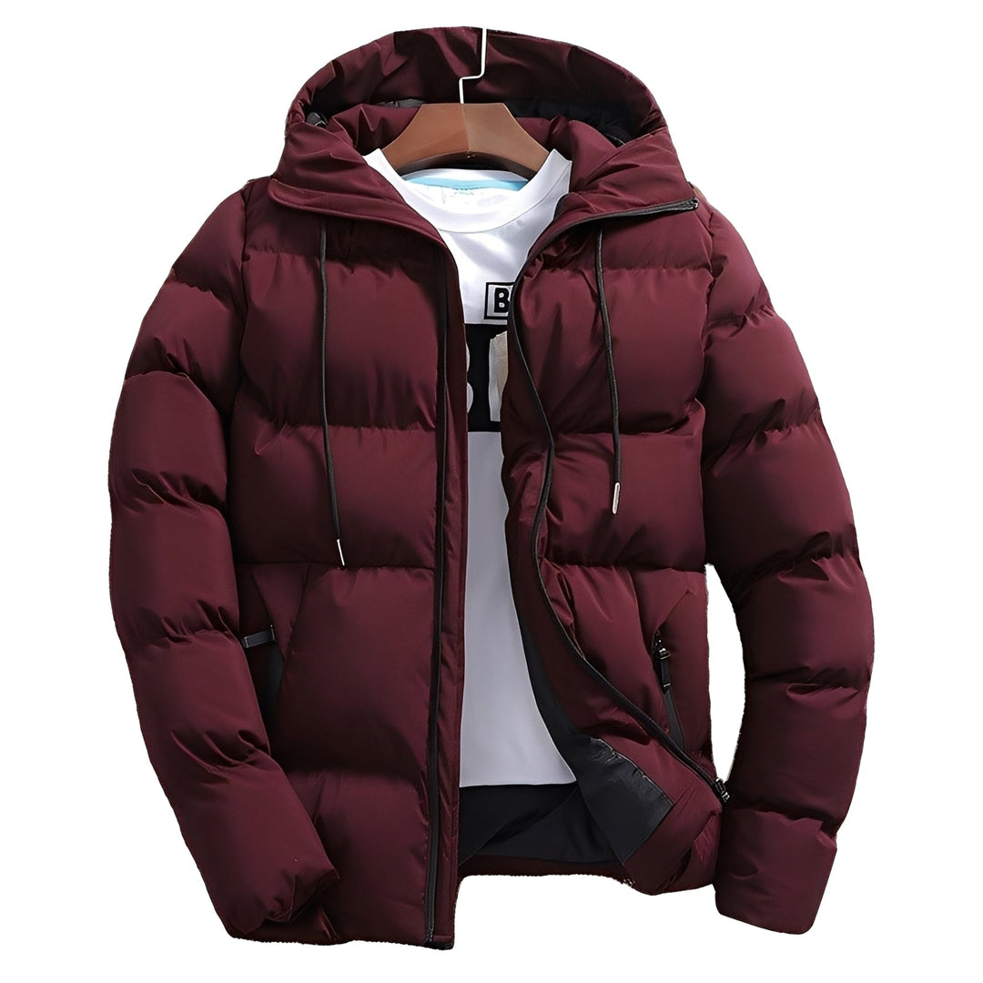 Casaco masculino acolchoado com capuz, repelente à água e resistente ao vento. Perfeito para o frio e atividades externas.