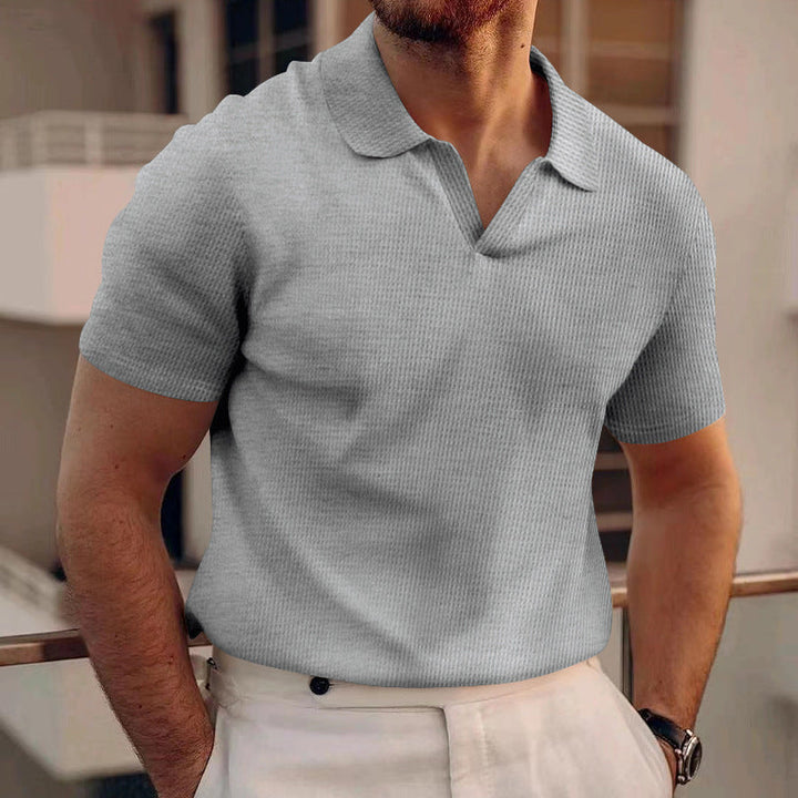 Polo masculina waffle elegante, ideal para um visual casual de verão com estilo.