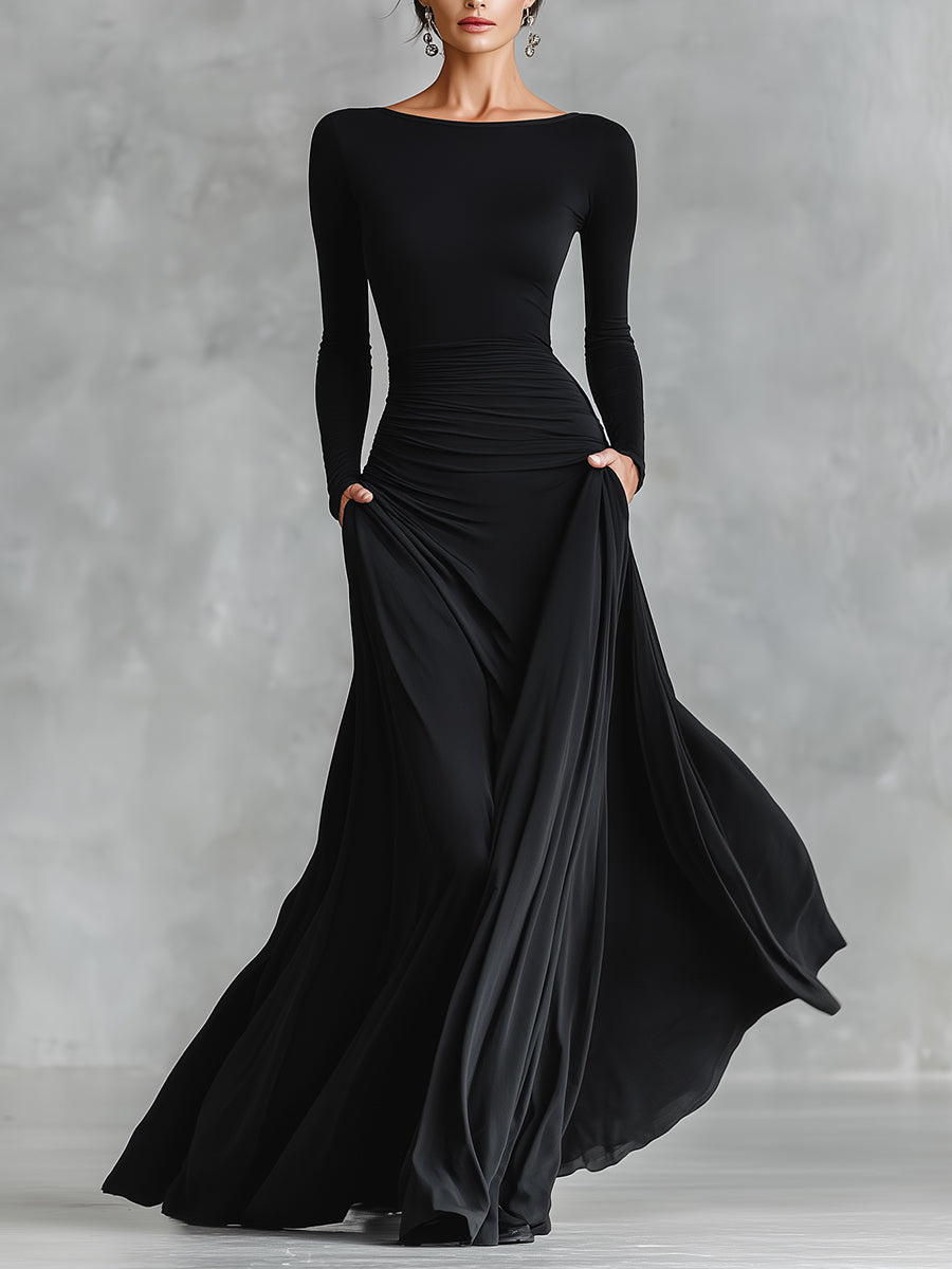 Vestido maxi feminino preto elegante com pregas fluidas, ideal para festas e jantares sofisticados.