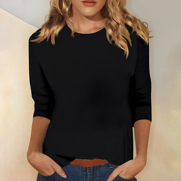 Camiseta feminina confortável de manga longa, gola redonda, ideal para diversas ocasiões no outono.