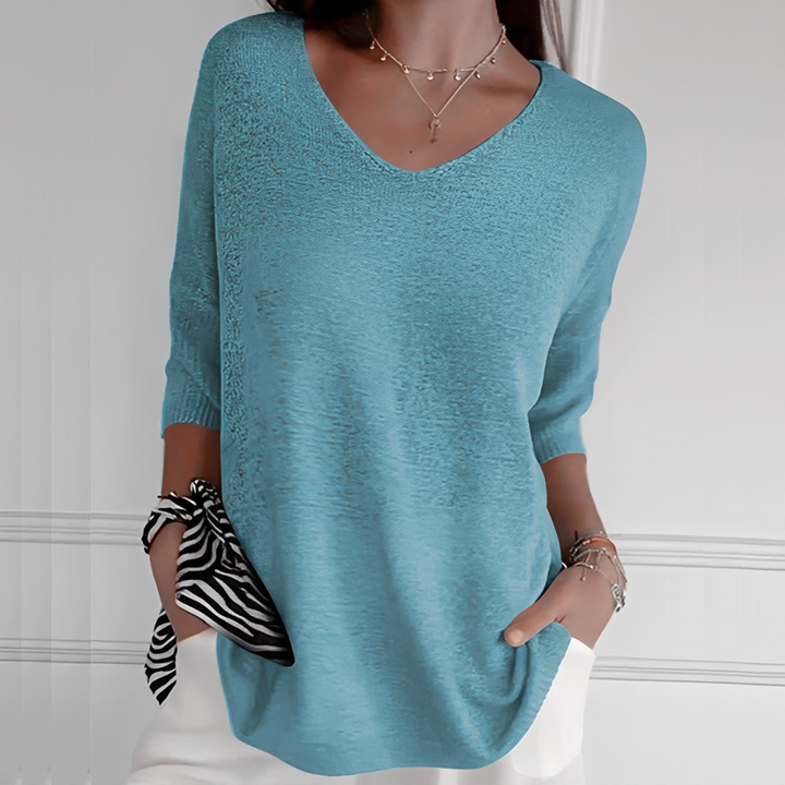 Suéter feminino longo em cor sólida, modelo elegante. Roupa confortável para outono/inverno.