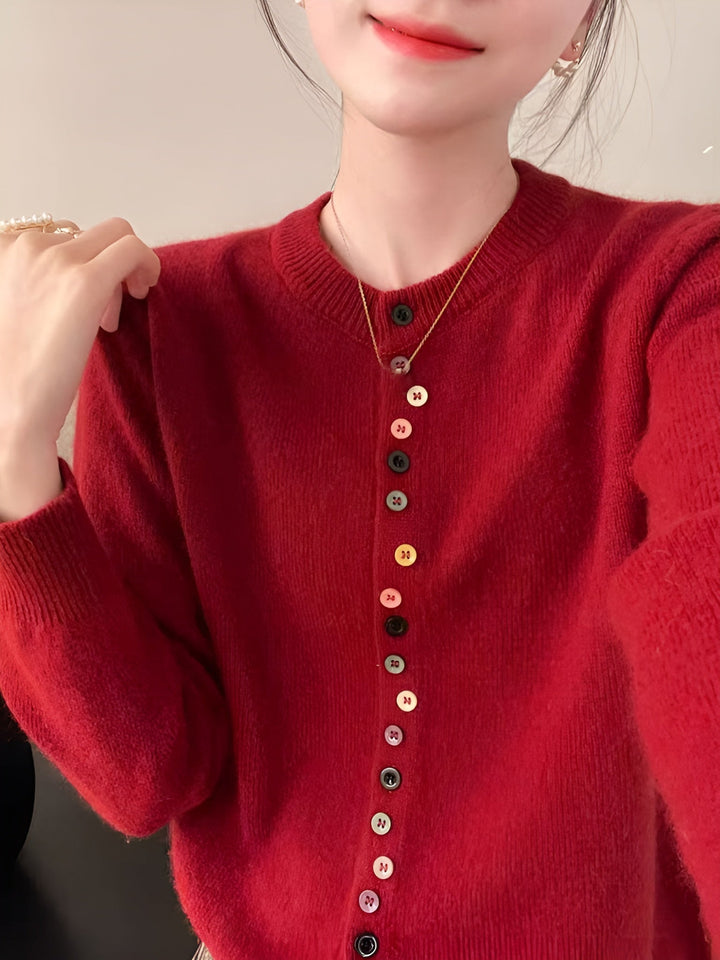 Colete de botões feminino Nora, roupa elegante sem mangas. Ideal para um look moderno e conforto diário na moda feminina.