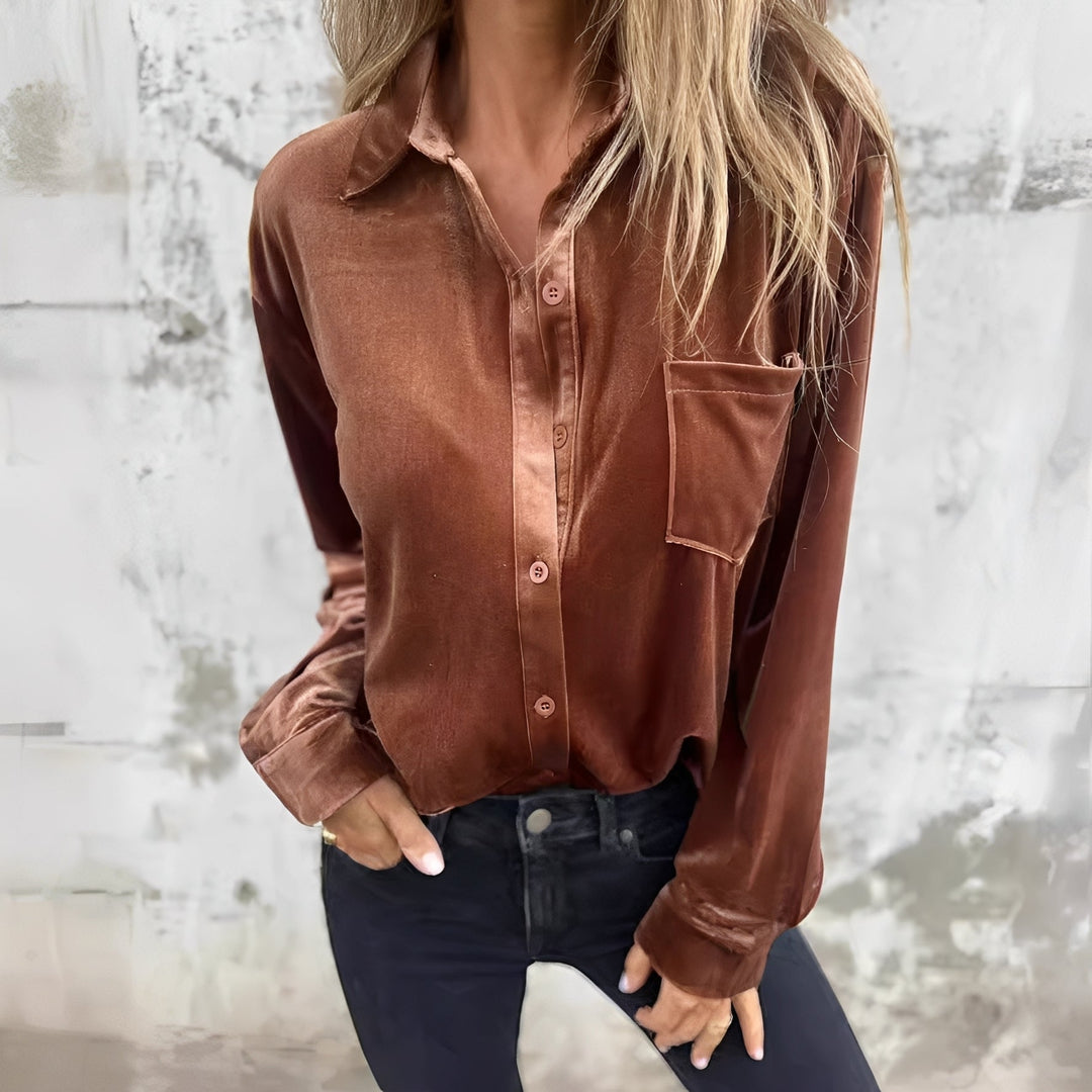 Blusa feminina elegante de manga longa com botões, perfeita para looks casuais e de escritório.