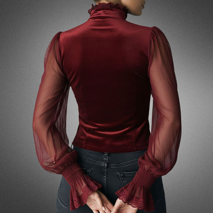 Blusa feminina sofisticada com renda, mangas transparentes e design chic, perfeita para diversas ocasiões.
