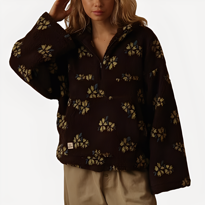 Pulôver feminino sherpa macio e quente, com estampa floral. Ideal para um look de inverno elegante.