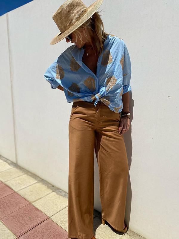 Blusa feminina bordada para primavera/verão, com botões decorativos, um toque de moda e sofisticação.