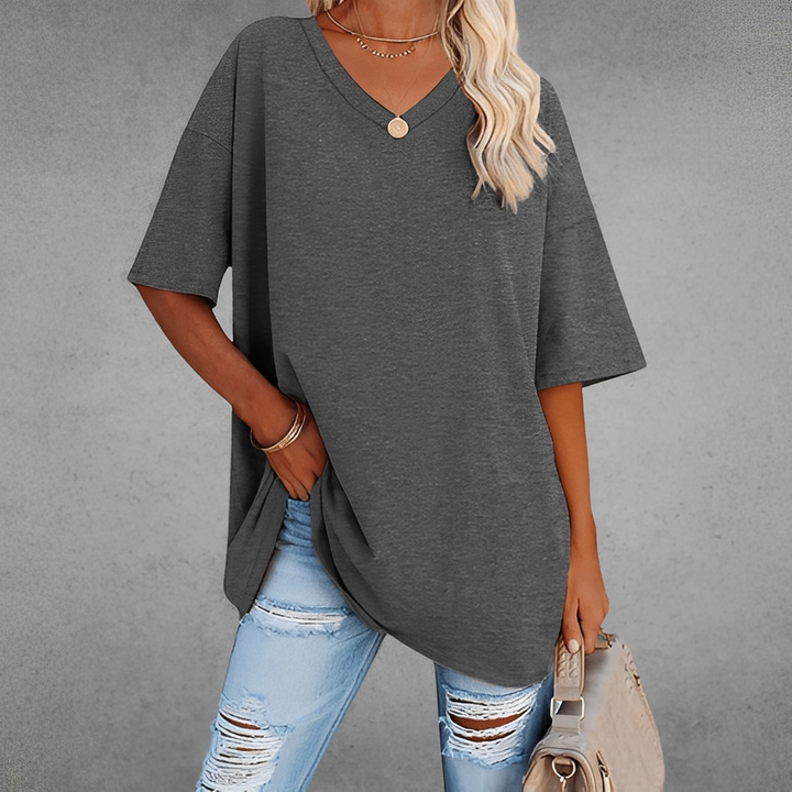 Blusa feminina elegante com decote V. Estilo e conforto para o verão. Roupa casual e moderna.