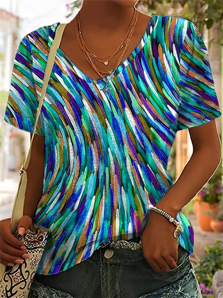 Blusa feminina estampada, ideal para o verão. Roupa casual e confortável, com estilo elegante e colorido.