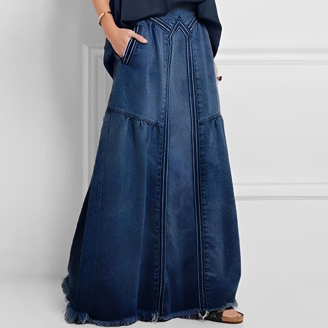 Saia jeans feminina confortável estilo vintage com bolso, ideal para o verão. Moda casual versátil.
