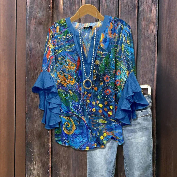 Blusa feminina floral plus size com decote V e manga babado. Ideal para primavera/verão e moda casual.