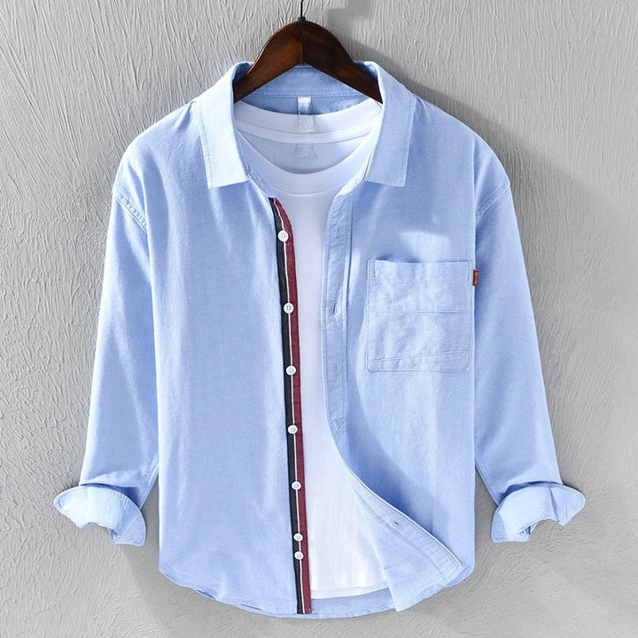 Roupa masculina: Camisa casual azul de manga longa, confortável e moderna para o dia a dia.