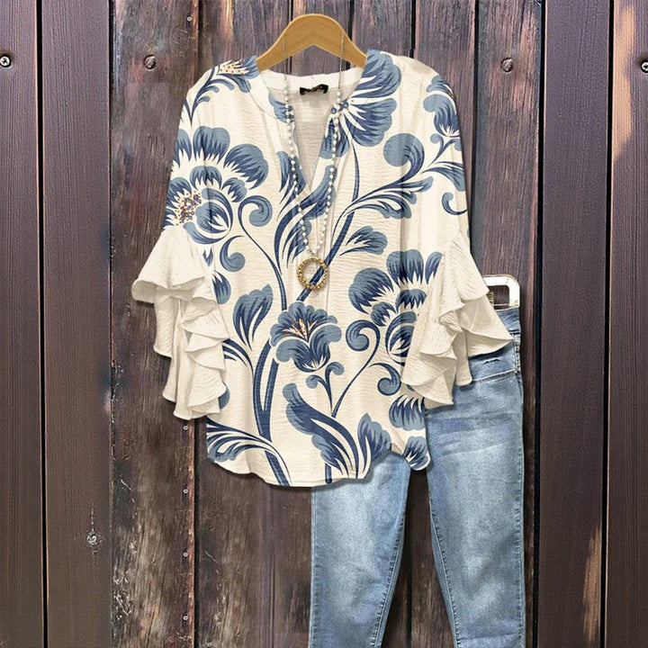 Elegante blusa feminina floral com decote V e manga babado, perfeita para primavera e verão. Moda feminina.