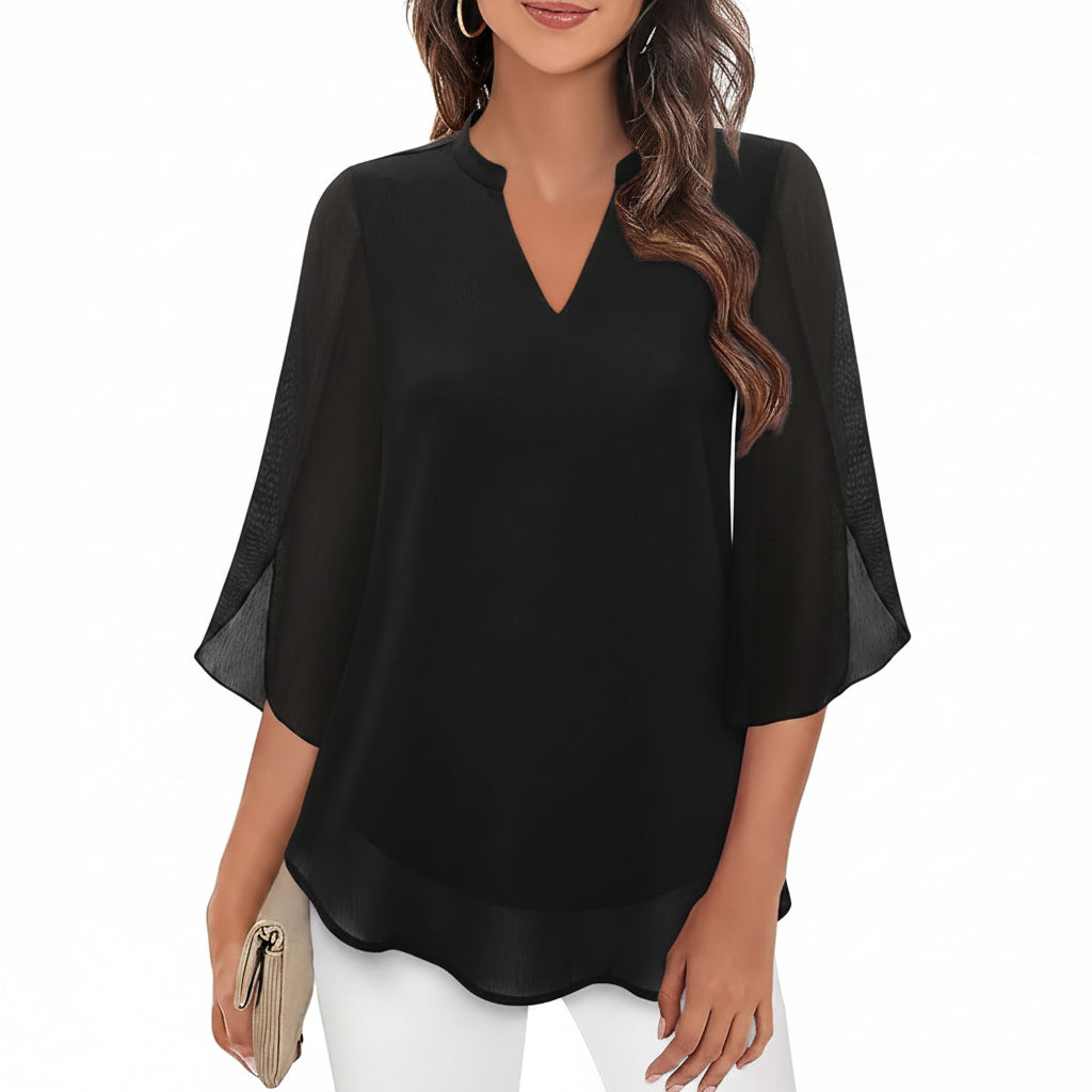 Blusa feminina elegante com mangas abertas e caimento solto. Perfeita para um look chique e confortável.