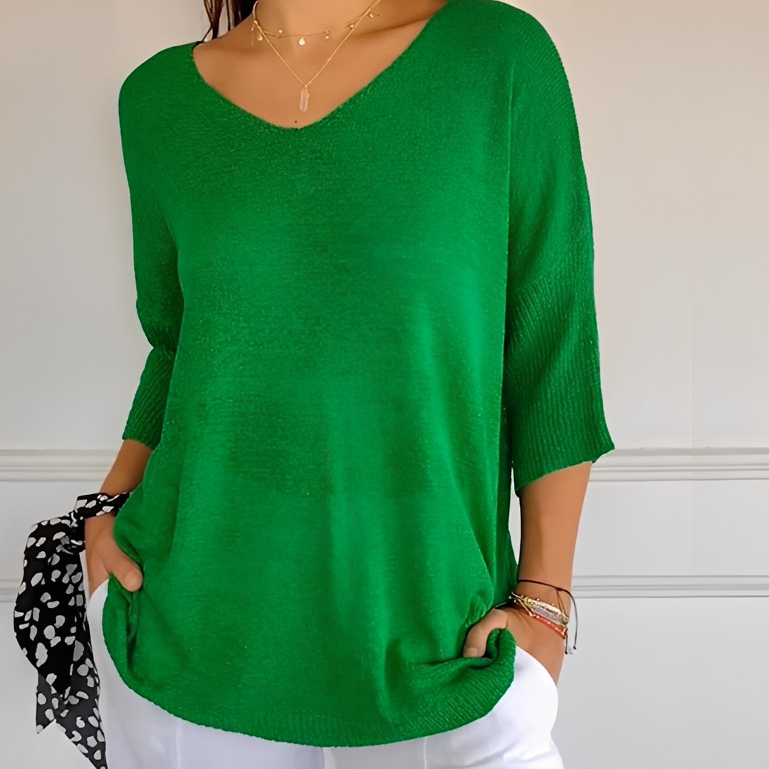 Suéter feminino longo elegante e confortável, item essencial de moda outono/inverno casual.